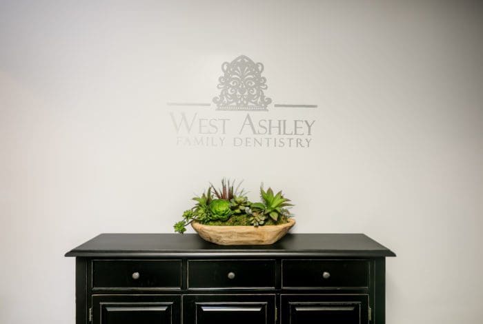west ashley dentist office interior logo
