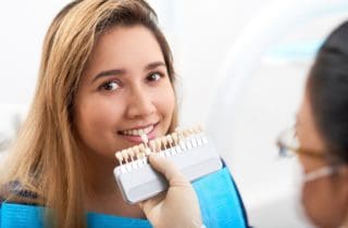 Woman deciding on whitening shade for treatment cosmetic dentistry dentist in Charleston South Carolina